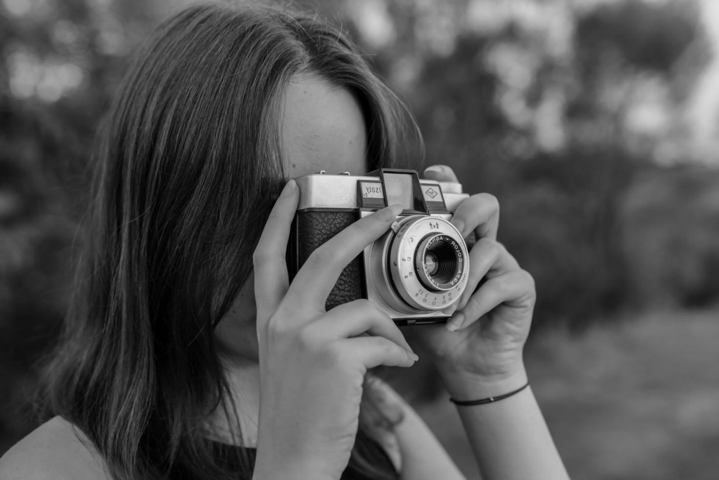 Photographer working on the street during an assignment exercise